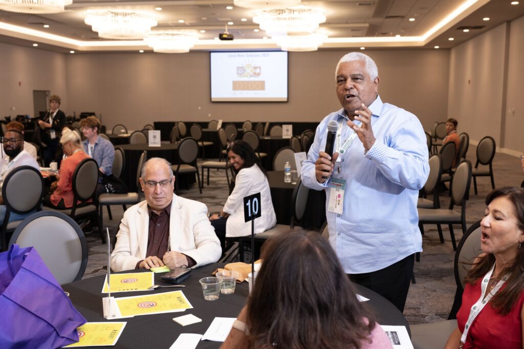 Bright ballroom in session during the convention